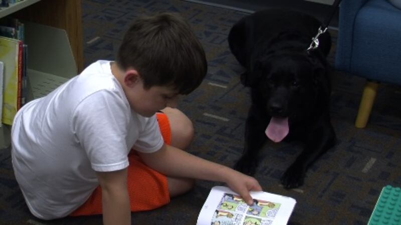 Cooper Reading With Rover Read to Rover event encourages kids to practice reading skills