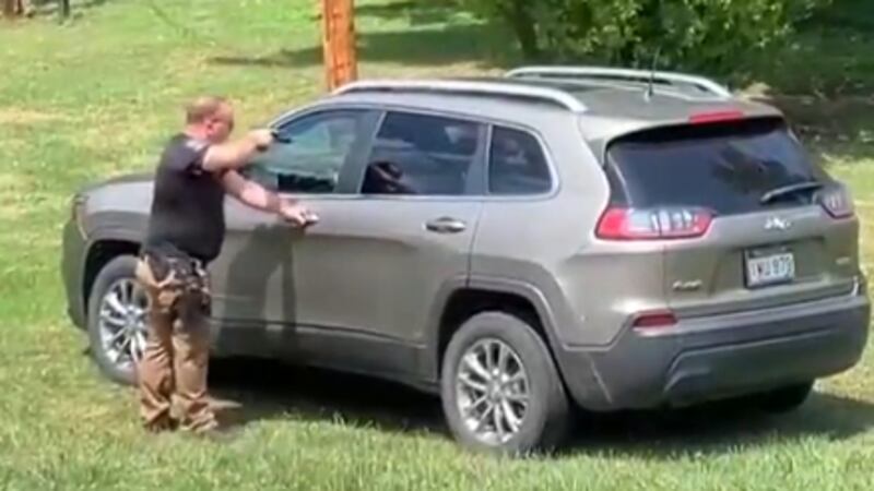 Video footage shows Monongah Chief of Police Nathan Lanham pointing a gun at a woman in her...