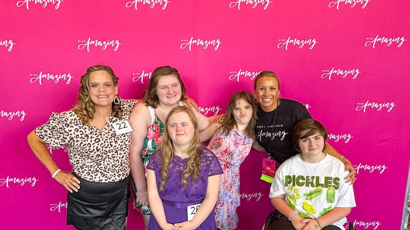 The 2025 West Virginia Miss Amazing delegation on the national stage in Chicago. Back row...