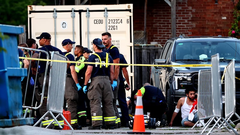 Paramedics respond to an active shooter at the Salsa on St. Clair event in Toronto, Saturday,...