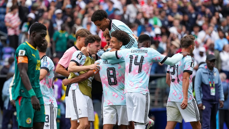 Belgium players celebrate a win during the World Cup round of 32 soccer match between Belgium...
