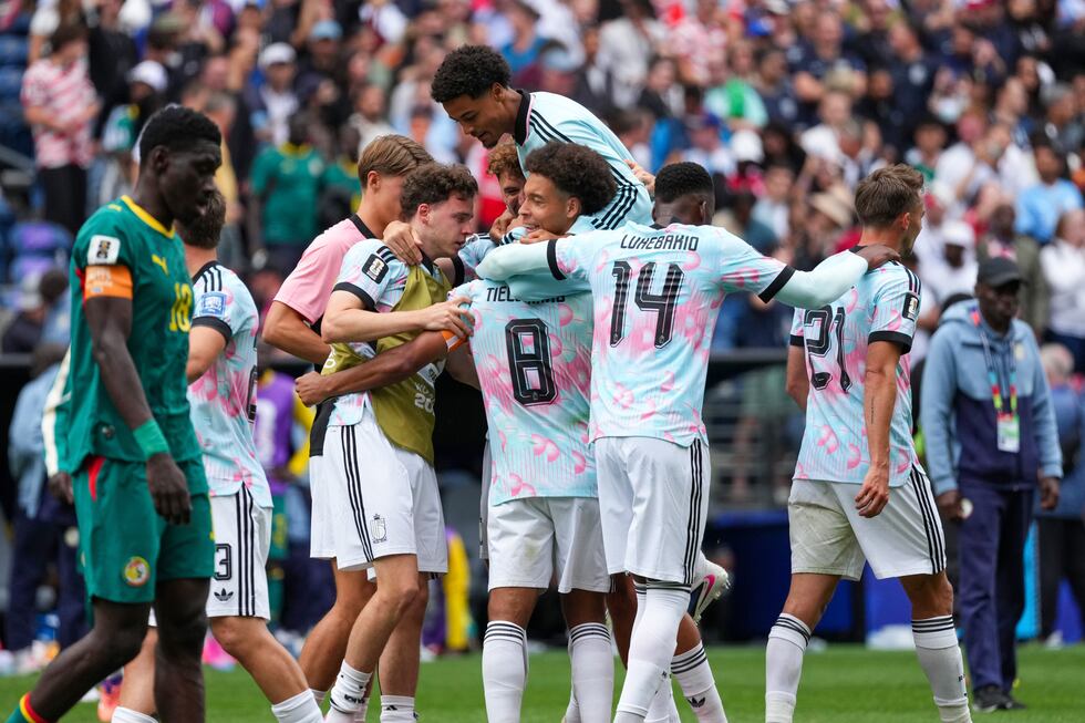 Belgium players celebrate a win during the World Cup round of 32 soccer match between Belgium...