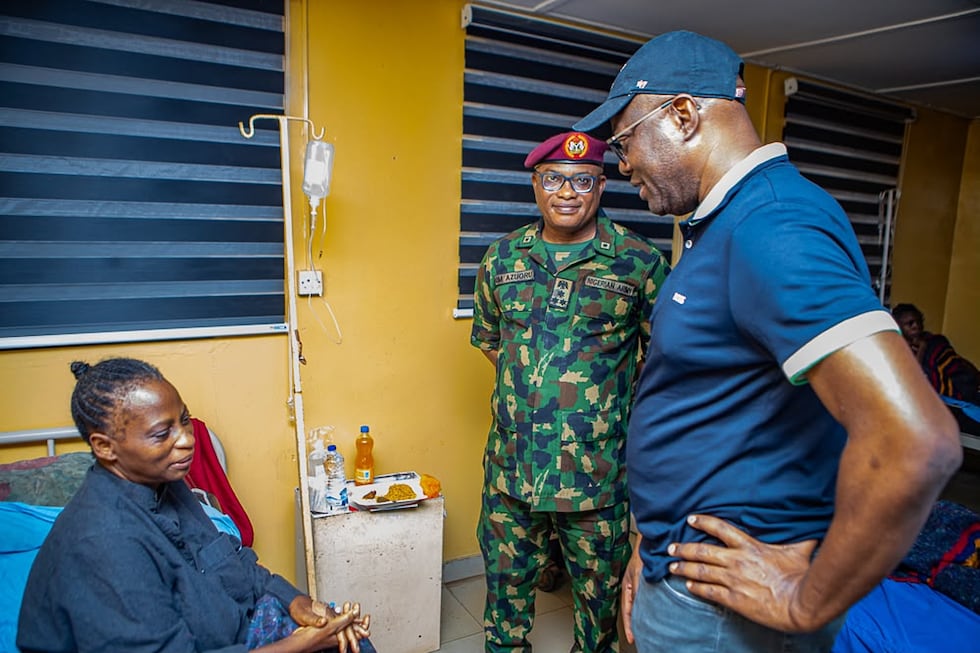 In this photo released by Oyo state government House, Governor Seyi Makinde, right, visits a...