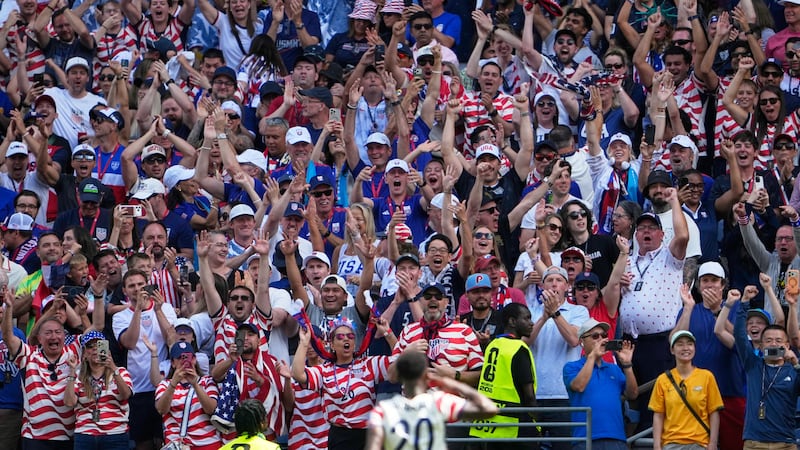 United States' Folarin Balogun celebrates their first goal with the fans during the World Cup...
