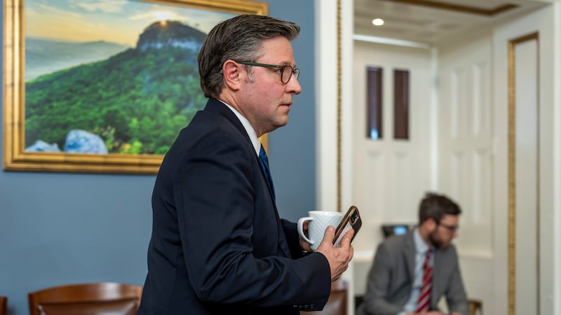 Speaker of the House Mike Johnson, R-La., walks through the House Rules Committee hearing room...