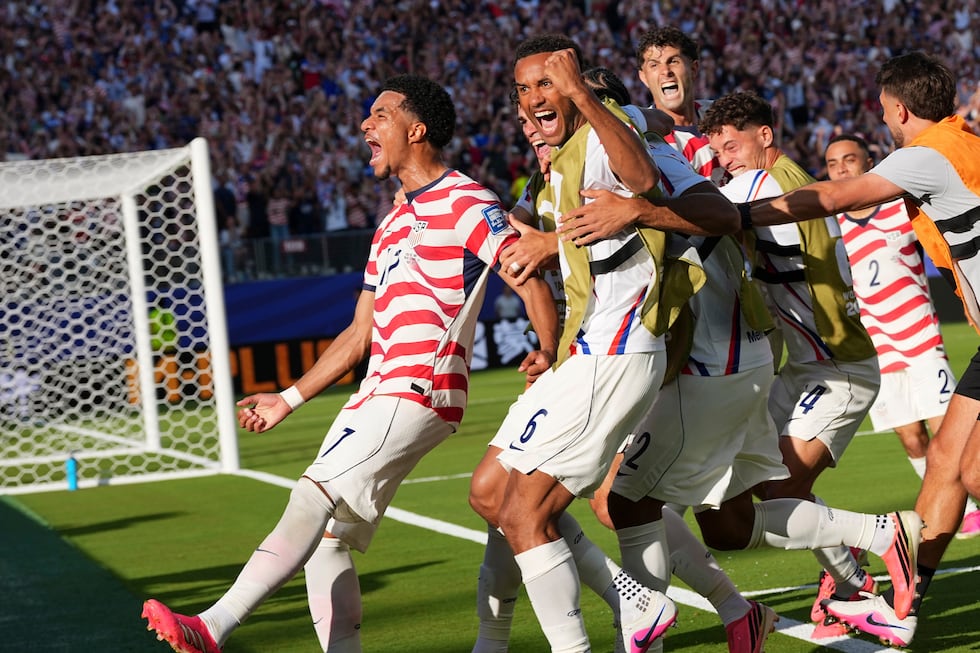 United States' Malik Tillman (17) celebrates with teammates after scoring on a free kick...