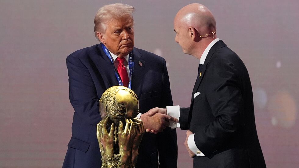 President Donald Trump receives the FIFA Peace Prize from FIFA President Gianni Infantino...